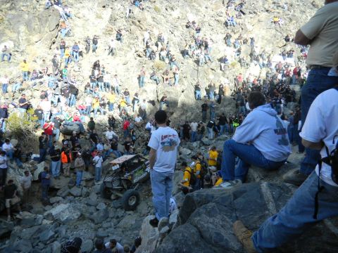 1997 Ford Ranger - Spectators watch an off-road buggy navigate a challenging rocky course.