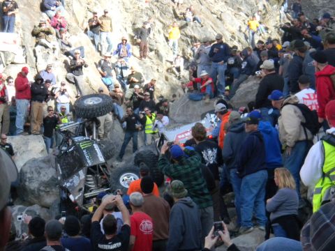 1997 Ford Ranger - A crowd watches as an off-road vehicle navigates a difficult rocky terrain during a race.
