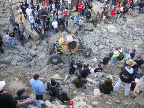 1997 Ford Ranger - Spectators watch an off-road buggy navigate a challenging rocky course.