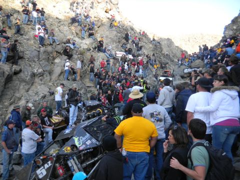 1997 Ford Ranger - A crowd watches an off-road race vehicle navigate a rocky terrain during an event.