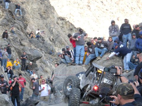 1997 Ford Ranger - Spectators watch an off-road buggy navigate a steep, rocky terrain during an event.