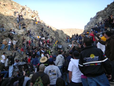 1997 Ford Ranger - Spectators gather on steep, rocky hillsides to watch off-road vehicles compete in a race.