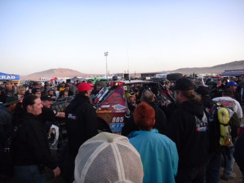 1997 Ford Ranger - A crowd gathers around an off-road race truck at an event.