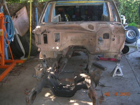 1985 Ford Bronco - This vehicle's body is disassembled, showing the frame and firewall. A date stamp indicates the photo was taken on February 14, 2010.