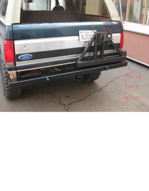 1989 Ford Bronco - Rear view of a 1989 Ford Bronco showing a custom bumper and spare tire mount.