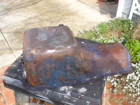 1978 Ford Mustang II - A heavily rusted oil pan sits on a table outdoors, with a timestamp visible in the corner.