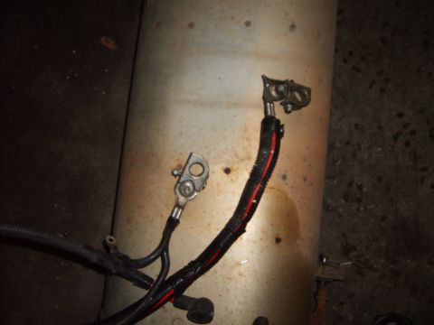 1993 Ford Crown Victoria - Close-up of automotive battery cables attached to a cylindrical component.