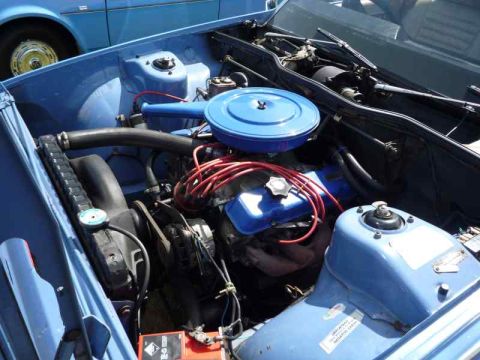 1969 MINI Cooper - A close-up view of a car's engine bay, showing various mechanical parts and wiring.