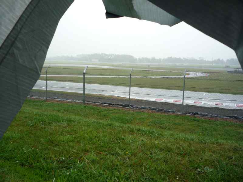 Racetrack viewed through a tarp in the rain