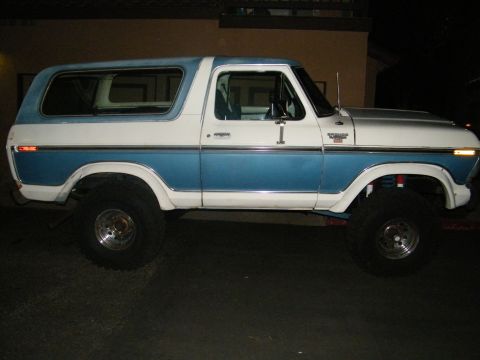 1982 Ford Bronco - This two-tone blue and white SUV features a lifted suspension and aftermarket wheels.