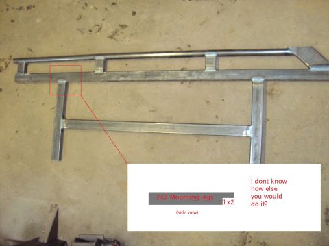 1996 Ford Bronco - Bare welded steel rock slider assembly laid out on a concrete garage floor, built from rectangular tubing with a top rail tied to the main…