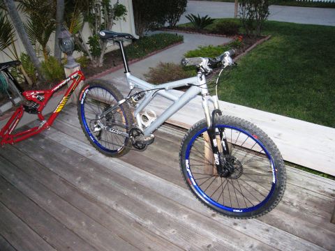 1986 Ford Bronco - Two mountain bikes are visible on a wooden deck, with one in silver and the other a red frame.