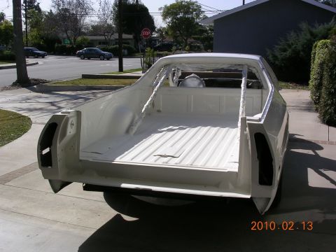 1972 Ford Ranchero - Rear view of a white 1972 Ford Ranchero undergoing restoration, showing the stripped bed and roll cage.