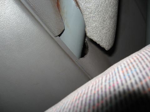 1994 Ford Bronco - Close-up view of the interior trim and seatbelt of a vehicle.