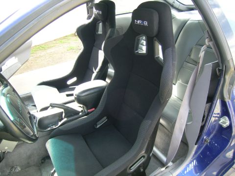 1995 Ford Probe - Custom racing seats installed in a vehicle's interior, NRG branding on the headrests.