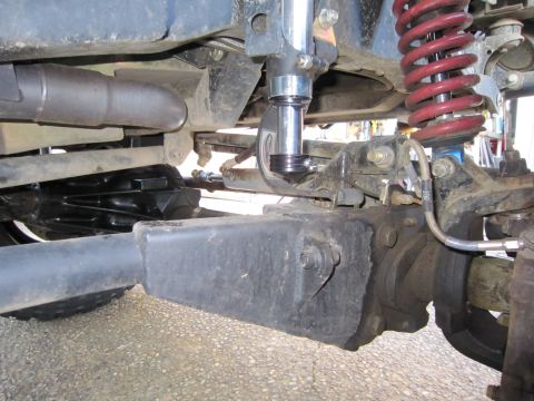 1996 Ford Bronco - This image shows the undercarriage of a modified off-road vehicle, focusing on the suspension components.