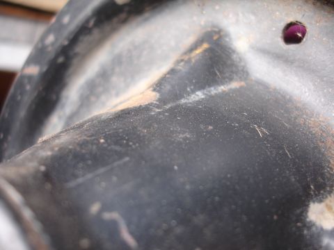 1995 Ford Taurus - This is a close-up view of an unidentified automotive component, showing wear and tear.