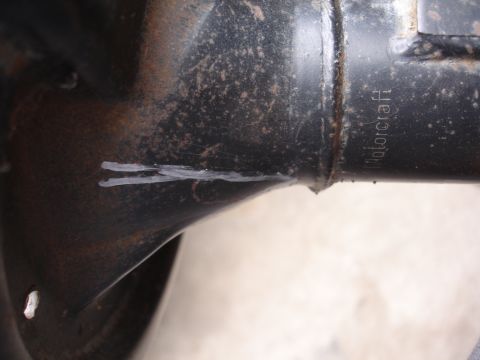 1995 Ford Taurus - Close-up of a black metal part showing white marks and "Motorcraft" branding.