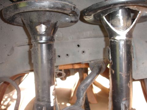 1995 Ford Taurus - Close-up view of the front suspension components, including the struts and sway bar.