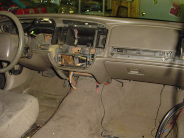 Interior dashboard of a 2000 Ford Crown Victoria with the center console disassembled