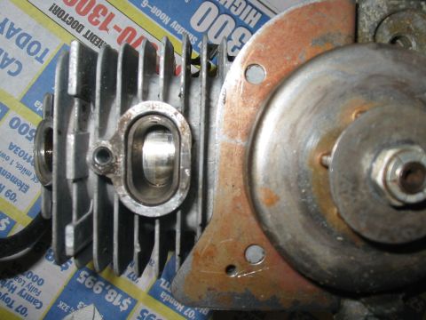 1992 Ford Bronco - Close-up of an engine cylinder and flywheel part, with visible rust.