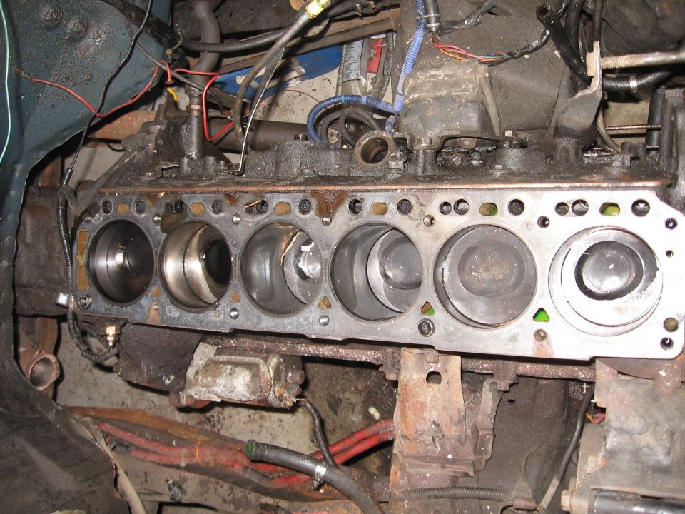 This is why I need / get to swap a 4BT into my Bronco.  Its a little hard to see, but the pistons in Cyl1 and Cyl5 are twisted, indicating the rods below are not connected.  I haven't gotten the pan off yet to see just how bad / impressive the damage is!