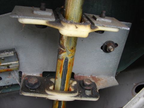 1973 Ford Ranchero - This image shows a close-up of a vehicle's steering column support mechanism, showing signs of rust and wear.