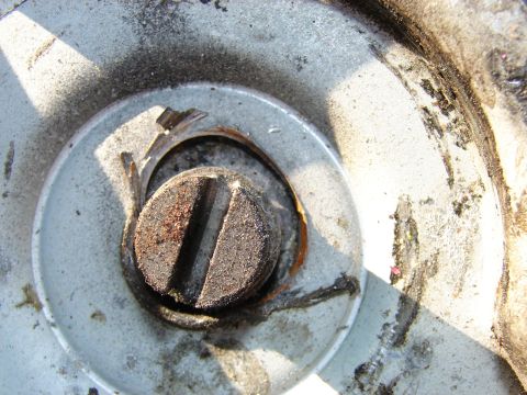 1973 Ford Ranchero - A rusty screw is visible on a weathered metal surface, suggesting wear and tear.