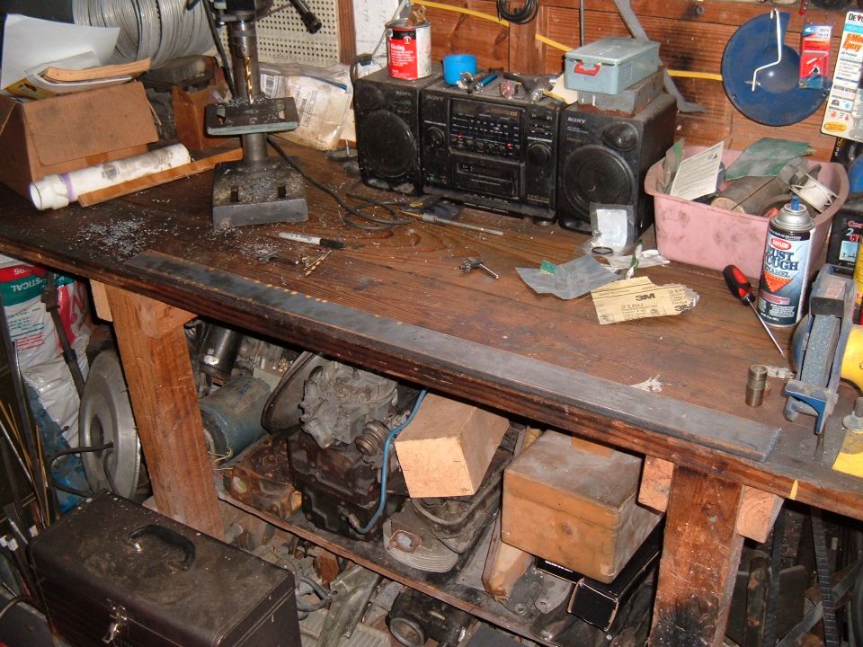 One piece of 1/2" x 2 1/2" flat stock long enough for two new header flanges.