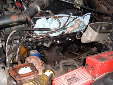 1981 Ford LTD - I used the cardboard to mark and drill the outermost bolt holes. Then I made relief cuts along the bottom to clear the head bolts and spark…