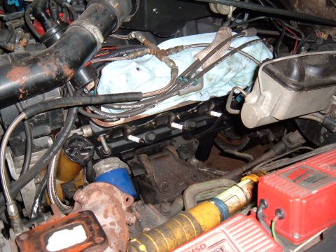 1981 Ford LTD - After I had clearance for the bolts and boots and got the plate sitting flush with the head, I needed to transfer the bolt holes from the h…