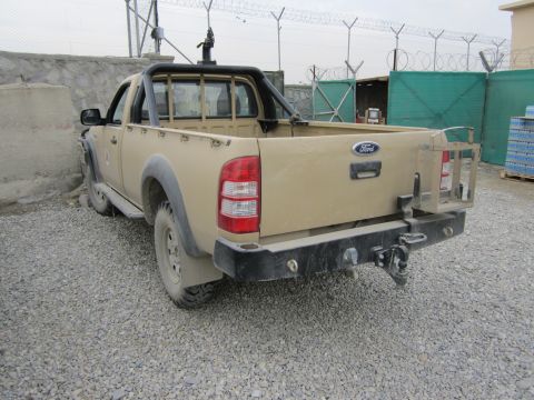 2003 Jeep Wrangler - Rear view of a tan Ford Ranger pickup truck with aftermarket modifications.