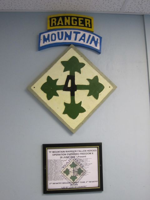 2003 Jeep Wrangler - Wall display military insignia and a document honoring fallen soldiers from Operation Enduring Freedom.