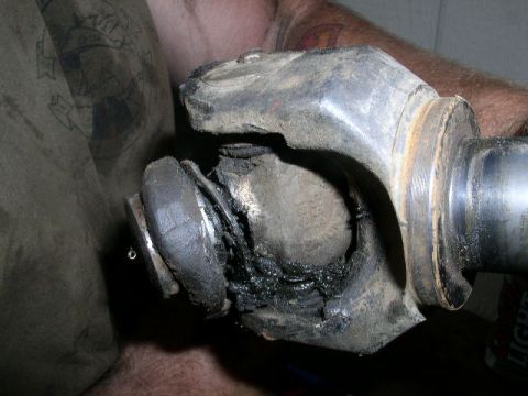 1979 Ford Bronco - This universal joint shows significant wear and a torn boot, indicating a need for replacement.