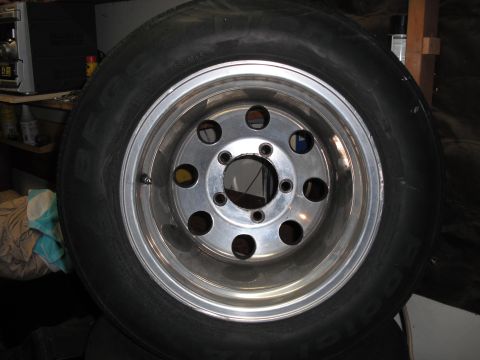 1991 Ford Bronco - Close-up of a tire and aluminum wheel, likely a spare or replacement part.