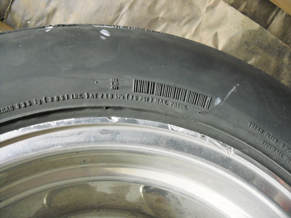 Close-up of tire sidewall showing load and pressure info