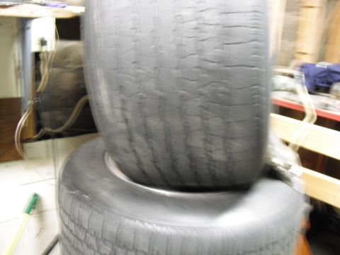 1991 Ford Bronco - Stack of two tires, showing tread detail on the lower tire.