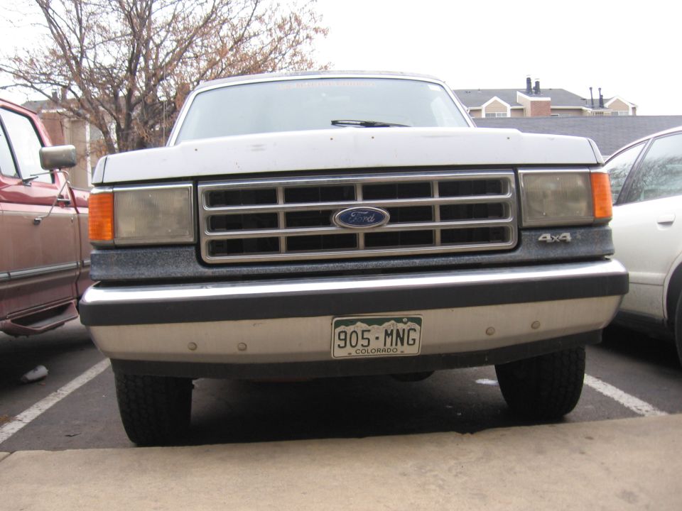 1987 Ford Bronco front grille with 4x4 badge and Colorado license plate 905-MNG