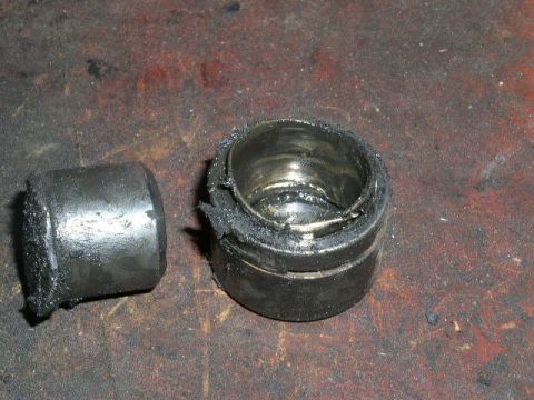 1979 Ford Bronco - This worn suspension bushing and its outer casing show significant wear and grease buildup.