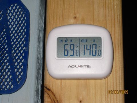 2003 Jeep Wrangler - Digital thermometer shows a significant temperature difference between indoor and outdoor readings.
