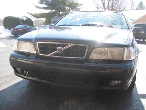 1993 Ford Probe - Front view of a black Volvo sedan, showing its distinctive grille and headlight design.