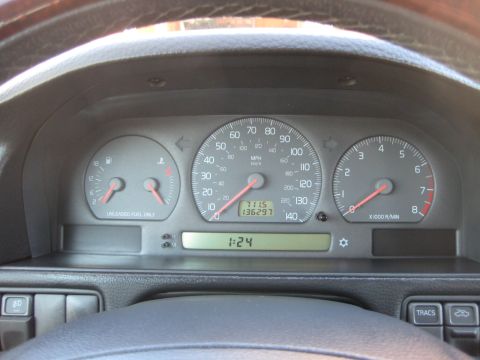 1993 Ford Probe - The dashboard displays various gauges and a digital clock, indicating the interior of a vehicle.