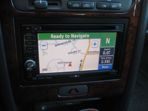1993 Ford Probe - The Kenwood navigation system is displayed on the car's dashboard, showing a map with street names and current time.