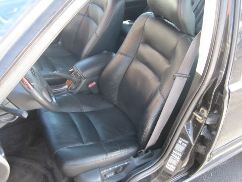 1993 Ford Probe - Interior view of a car, highlighting the black leather seats and door jamb details.