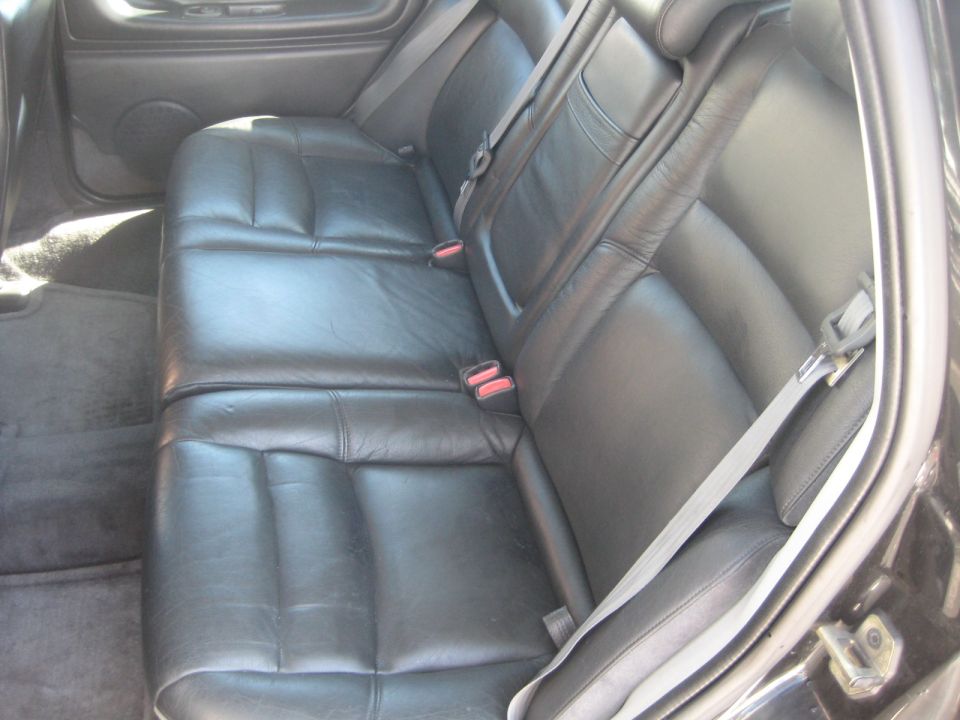 Rear leather seats with seatbelts visible