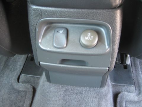 1993 Ford Probe - Interior view of a vehicle's center console, showing a 12V power outlet and a heated seat control.