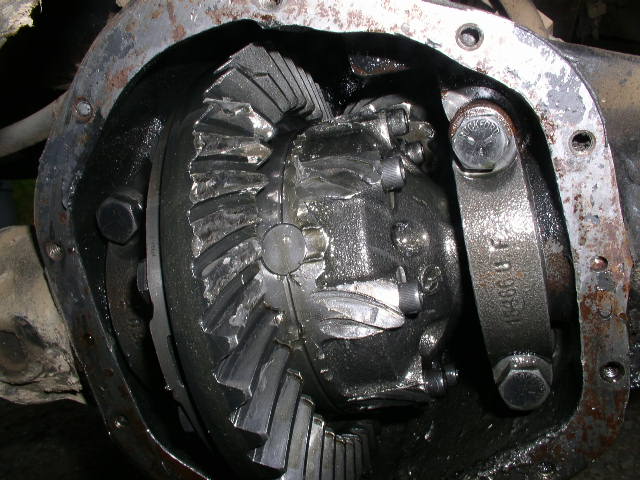 close-up of damaged differential gears with part number 15386 8 F visible