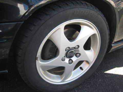 1993 Ford Probe - Close-up of a car's wheel, showing the Volvo logo on the hubcap.