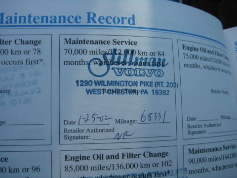 1993 Ford Probe - This document shows a maintenance record with service details and a dealership's information.
