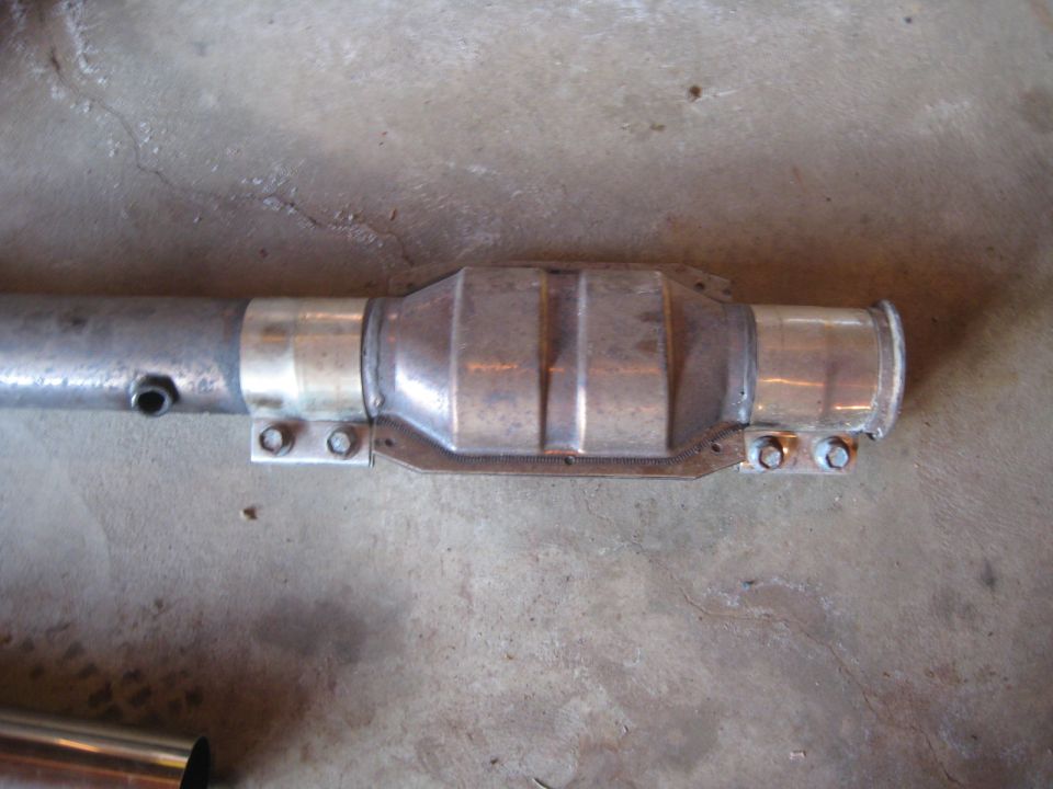 catalytic converter attached to exhaust pipe with clamps